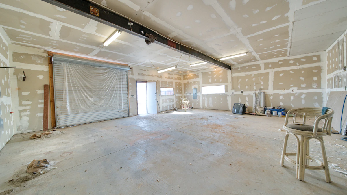 Unfinished drywall with joint compound on walls in a renovation space